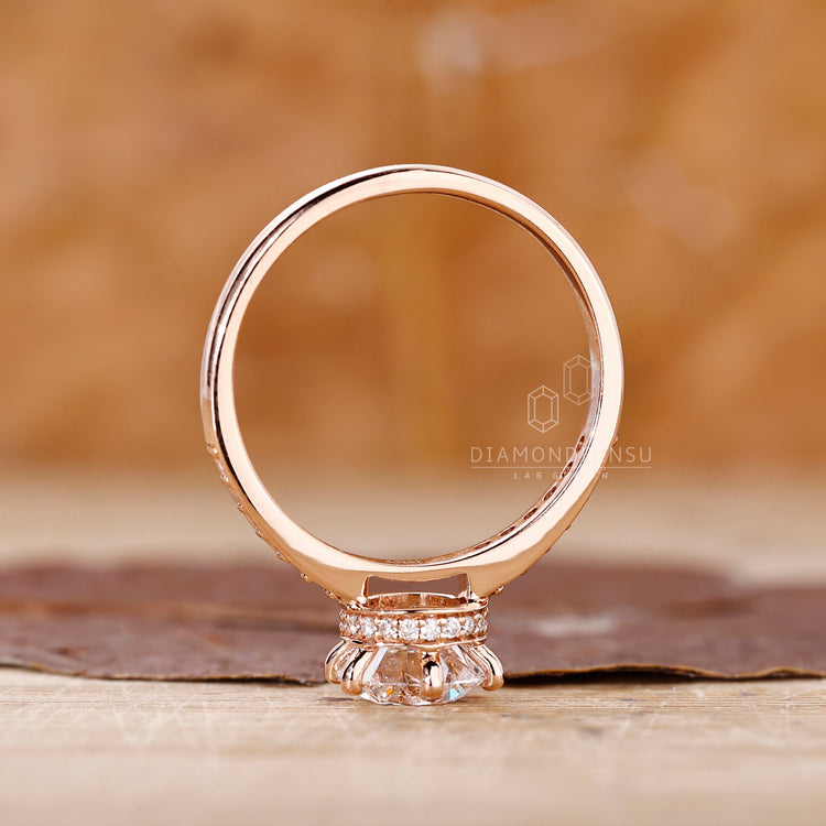Diamondrensu UK engagement ring with a round cut and 6 prong setting.