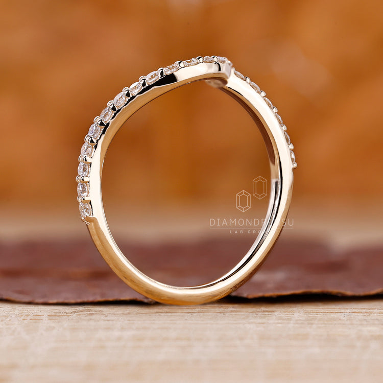 Buy wedding band with round diamonds in a handmade setting.