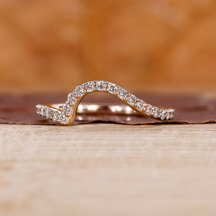 Ocean wave wedding band in yellow gold with a minimalist design.