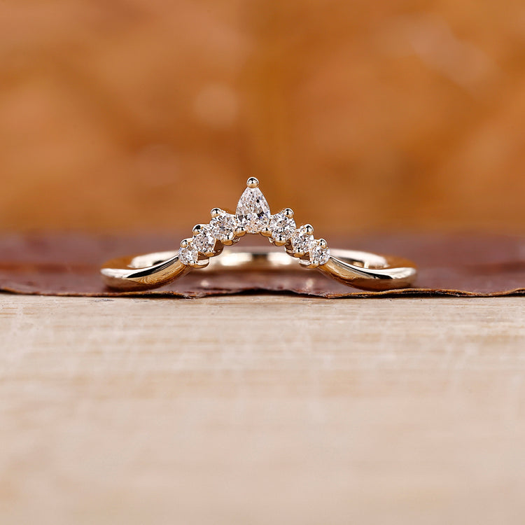 7 stone diamond band crafted in yellow gold with a prong setting.