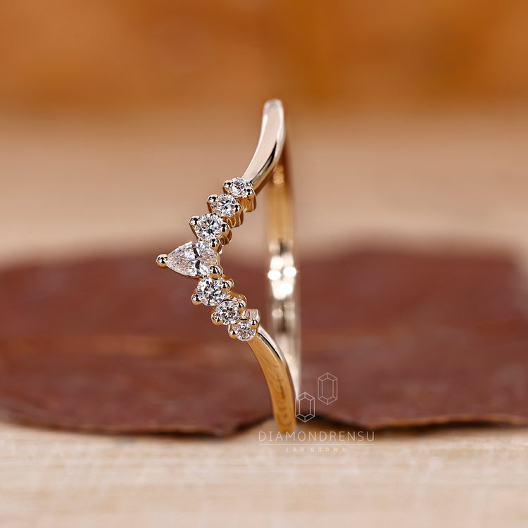 Simple wedding band handmade with curved lab grown stones.