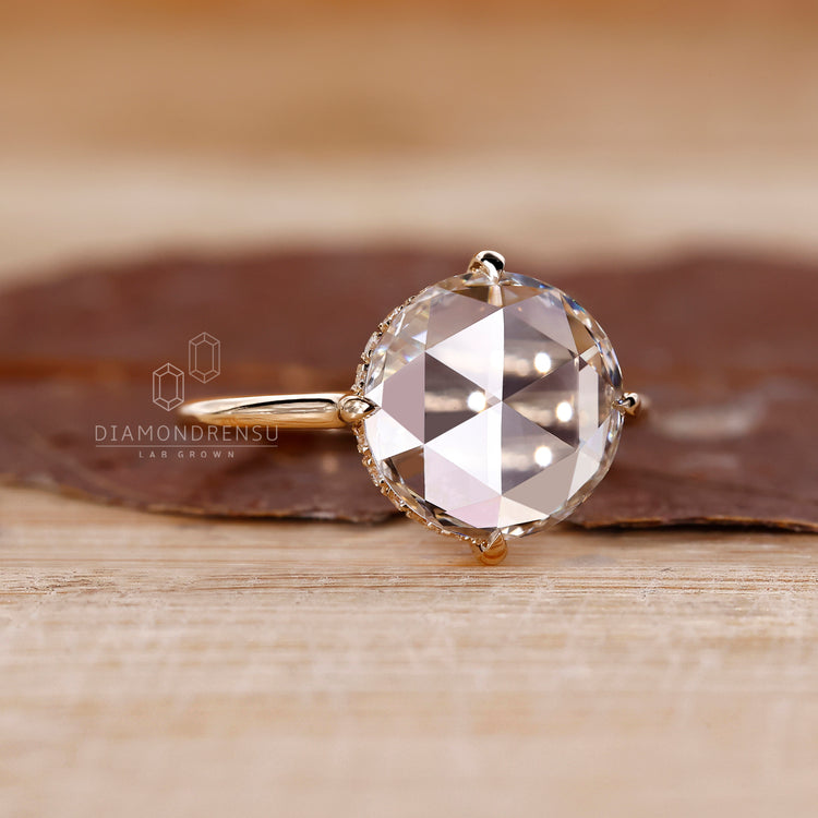 Yellow gold diamond ring with a round rose cut.