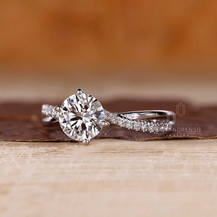 Four prong ring securing a sparkling diamond.