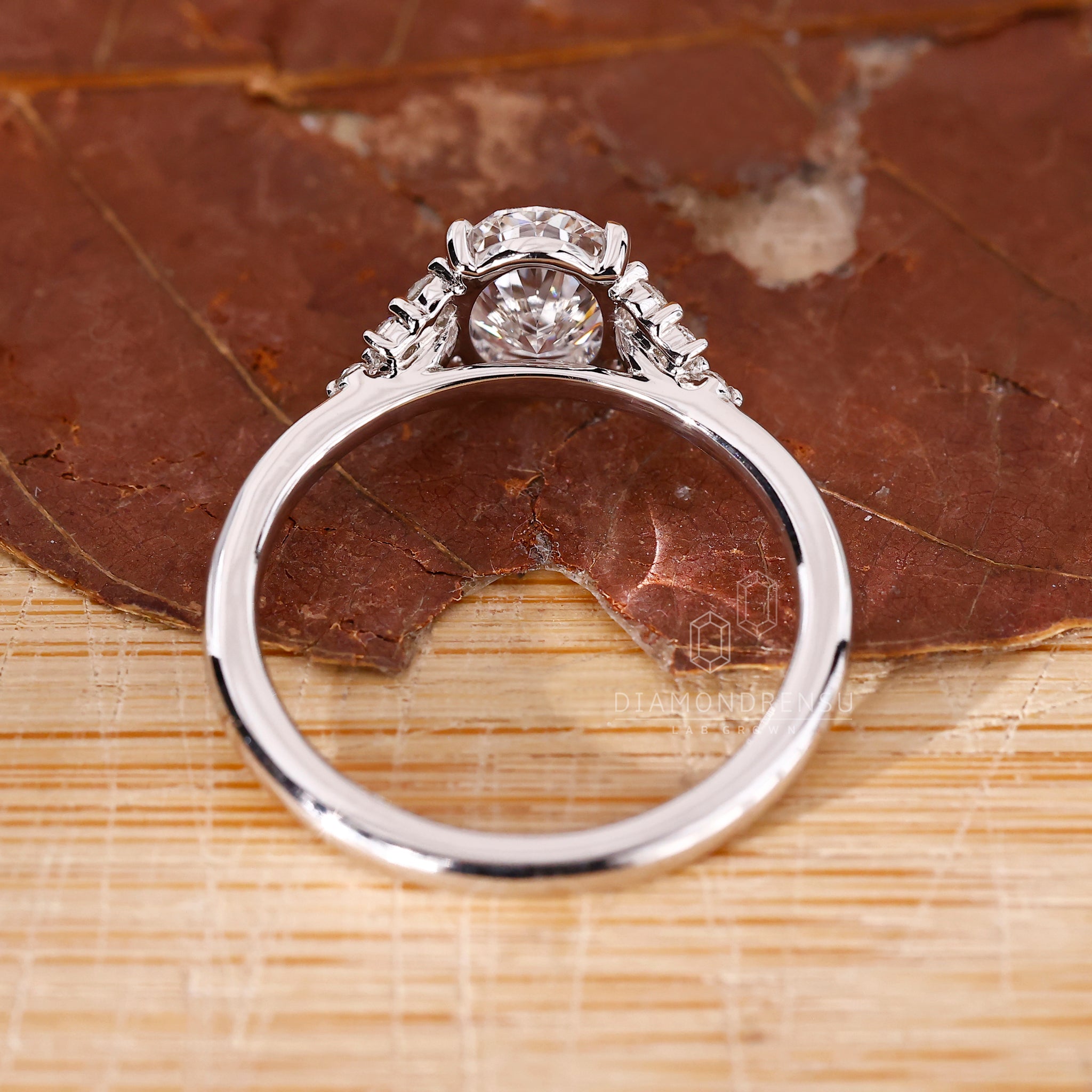 Cathedral setting engagement ring with oval diamond