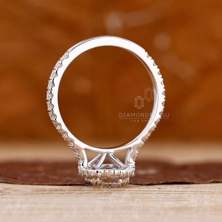 Diamondrensu cushion ring with milgrain and double claw prongs.