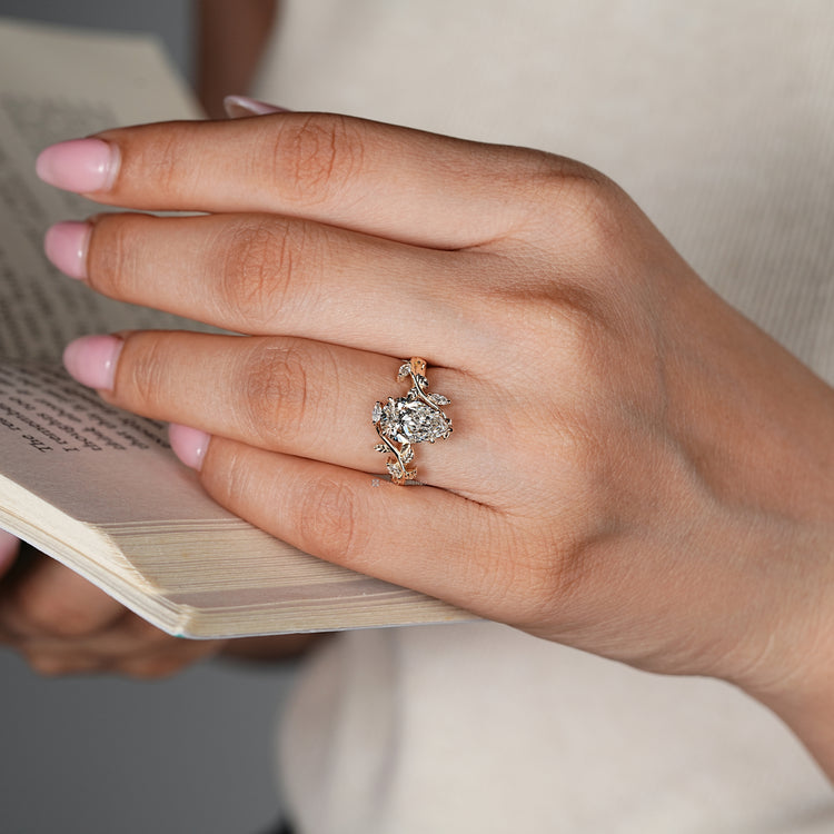Handmade pear diamond ring with five claw prong setting.