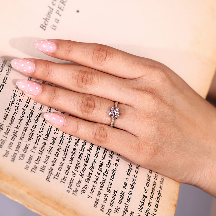 Handmade round cut ring with cathedral setting.