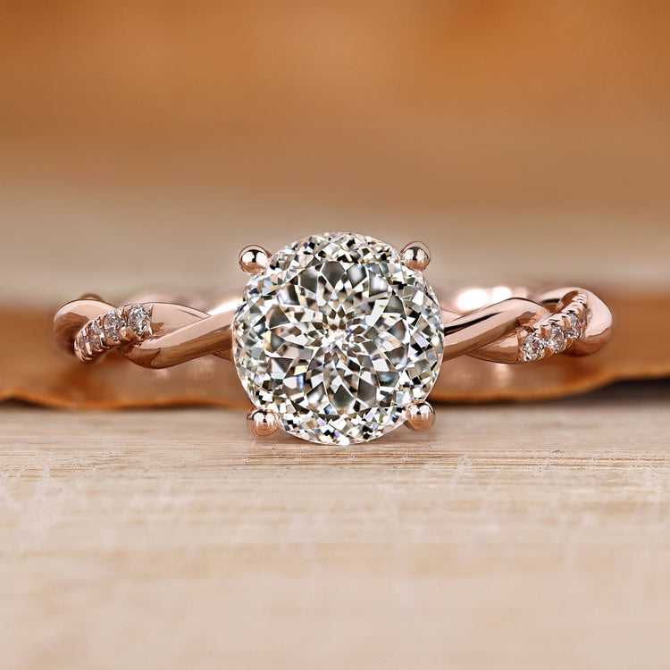 Twisted shank engagement ring with Portuguese cut diamond.