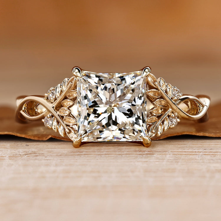 Princess cut diamond ring with round side stones.
