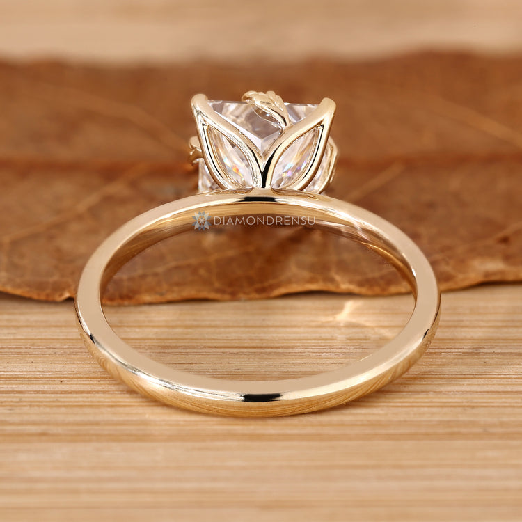 Princess cut diamond ring with a tulip setting.