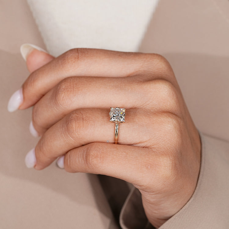 Handmade solitaire ring with four claw prong setting.