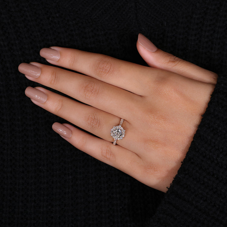 Cathedral setting ring featuring round cut diamond ring