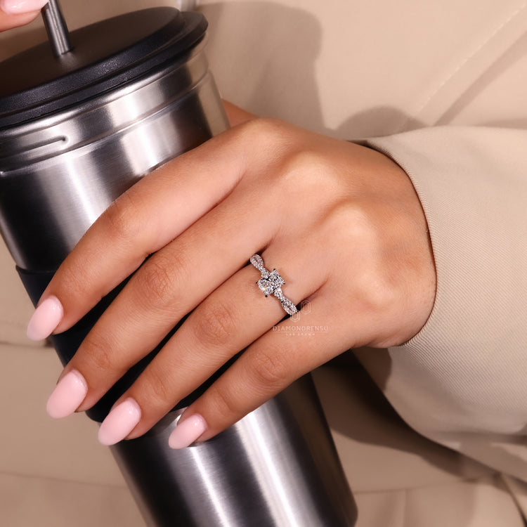 Cushion cut lab grown diamond ring with four claw prongs