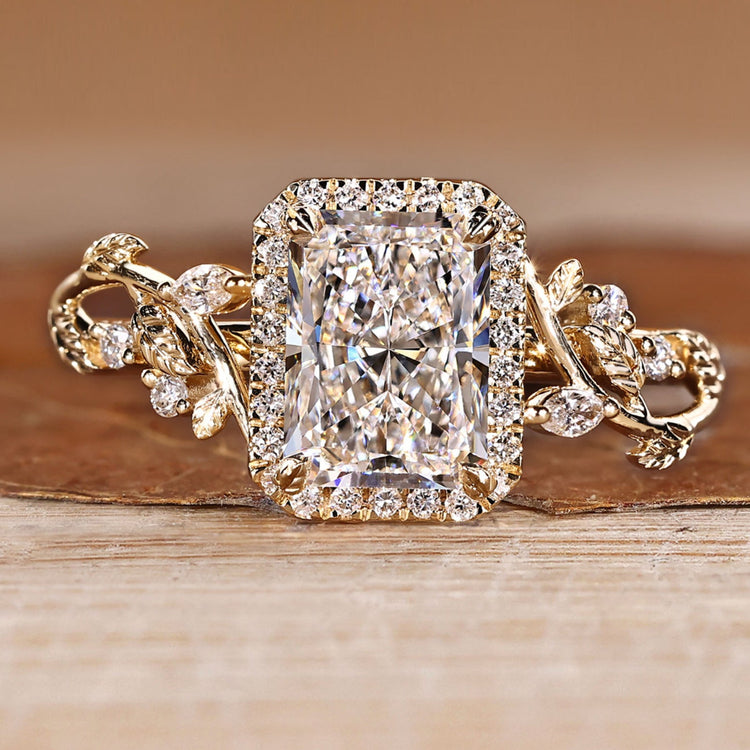 Radiant cut engagement ring with round diamond halo.