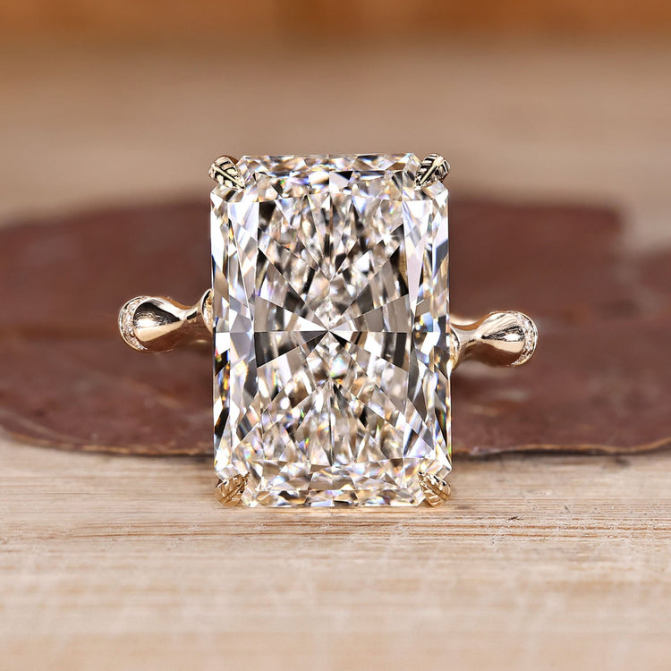 Radiant cut diamond ring with bamboo design band.