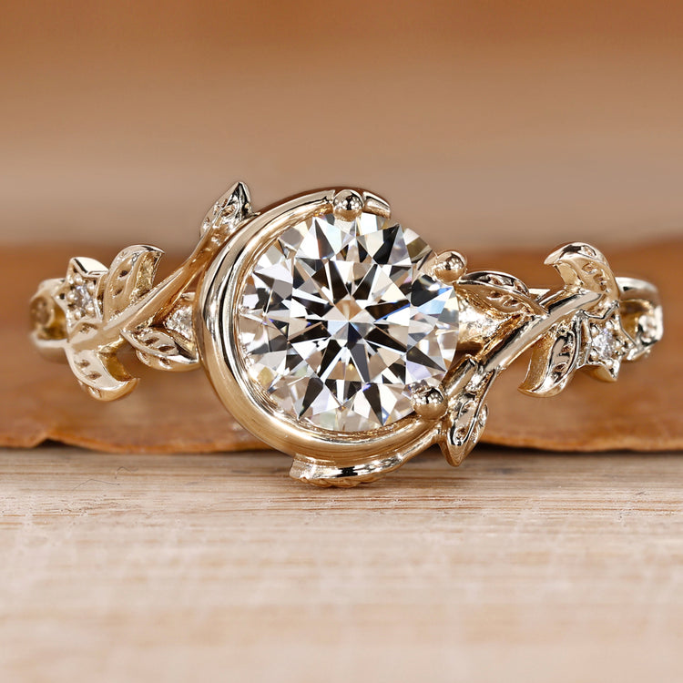 Round cut diamond ring with round side stones.