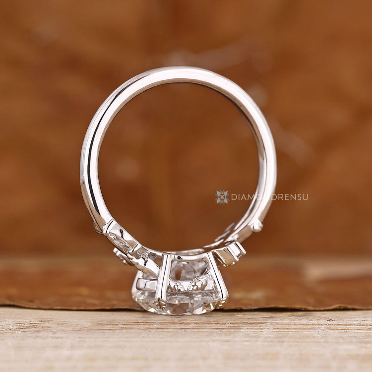 Round cut engagement ring with nature inspired style.
