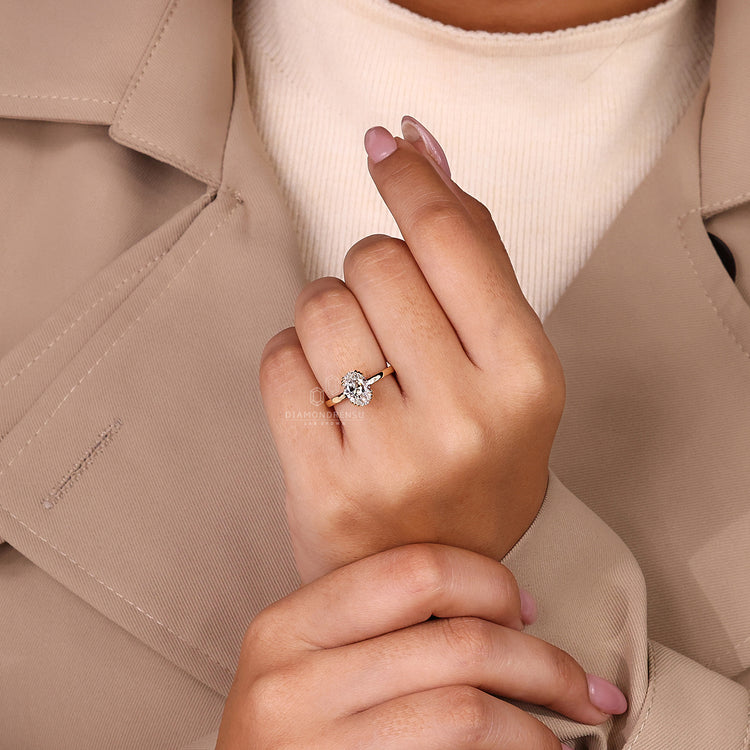 IGI certified oval diamond ring with triple claw prongs.