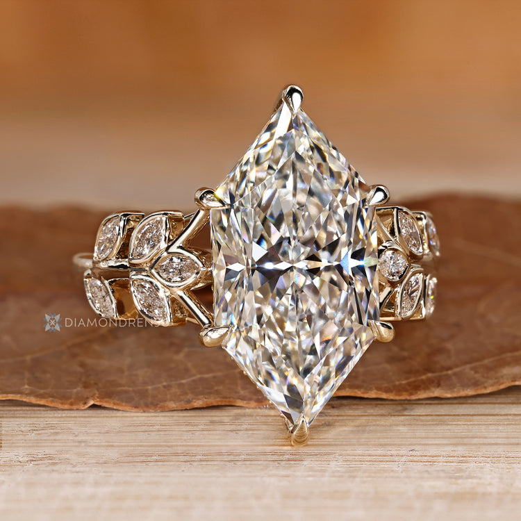 Dutch marquise diamond ring with six claw prongs.