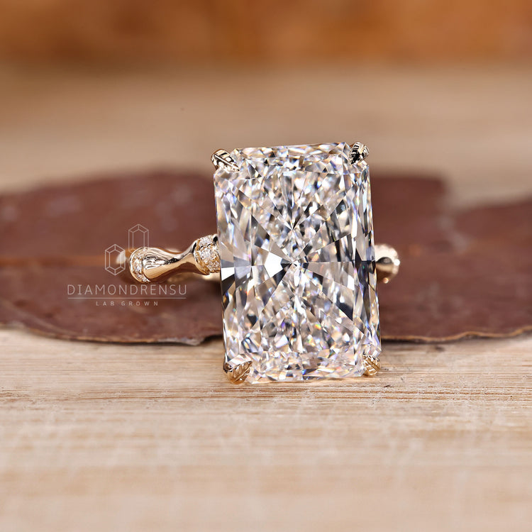 Radiant cut ring with round pave distance setting.