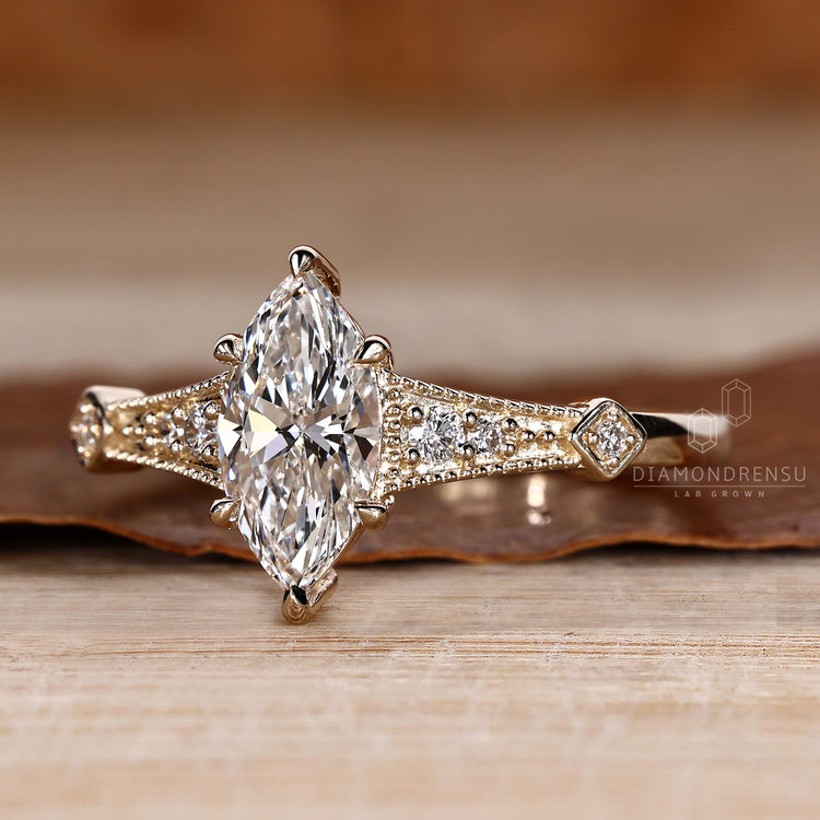 Vintage marquise diamond ring with milgrain edge detail.
