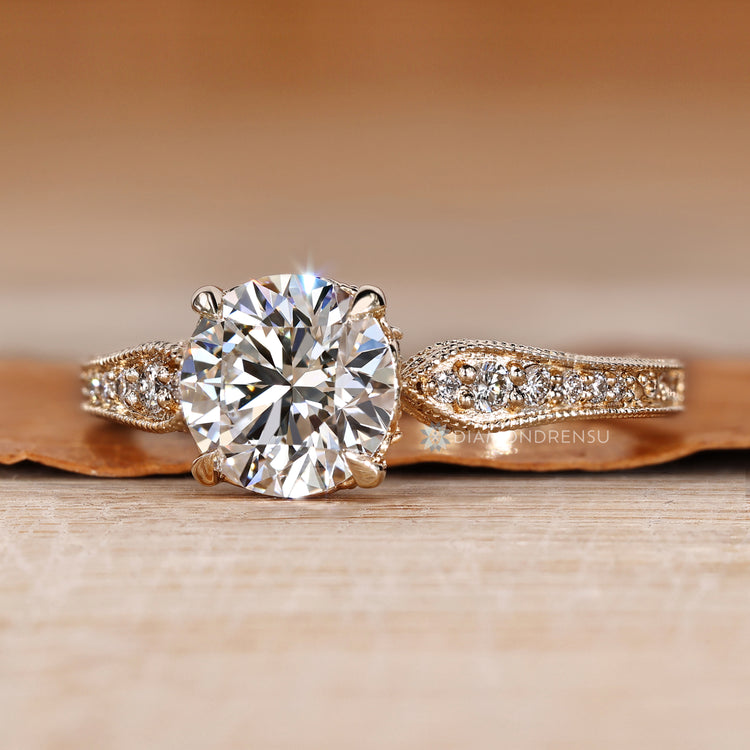 Round cut ring with hidden round diamonds and pavé style.