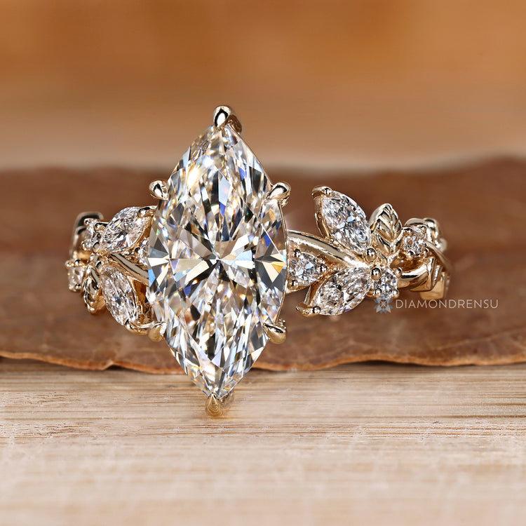 Marquise ring with round diamond side stones.