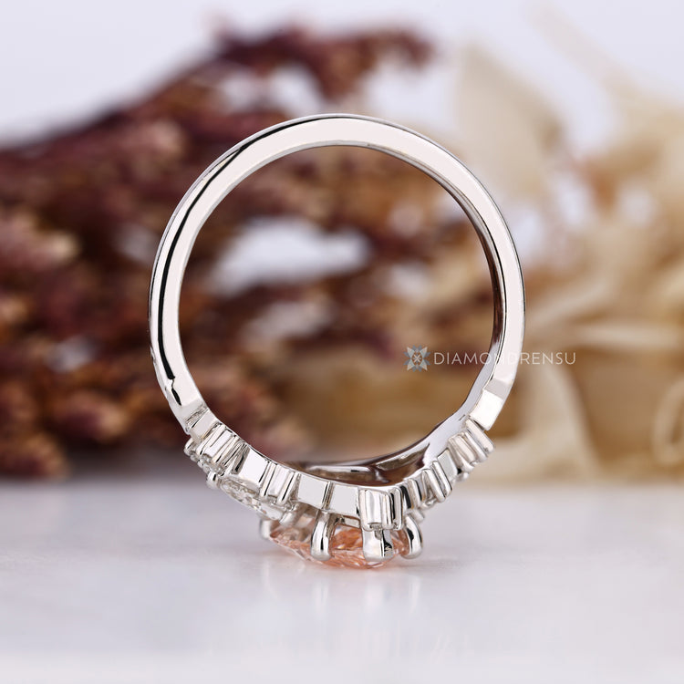 Marquise ring with round and trillion side stones.