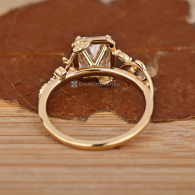 Handmade engagement ring with radiant centre diamond.