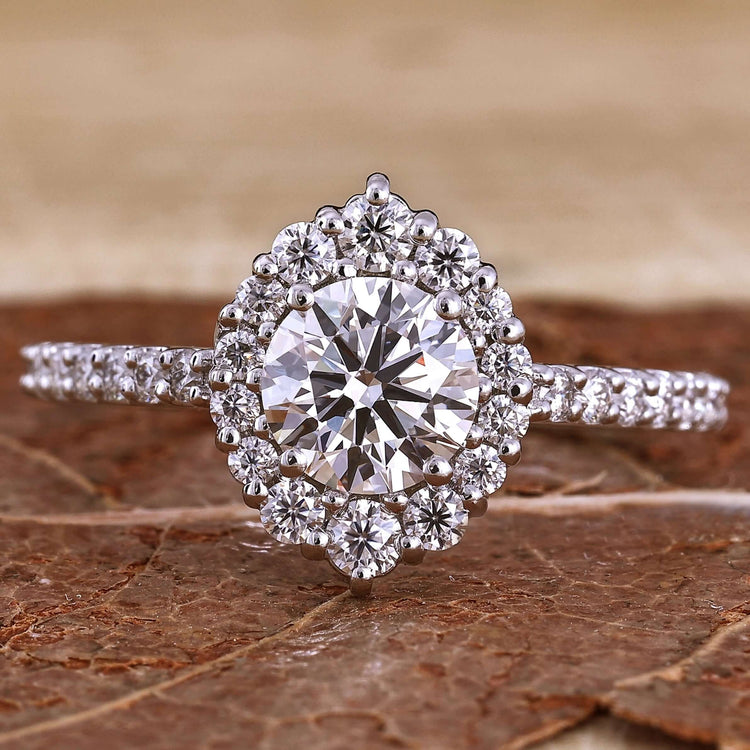 Cluster Ring with round brilliant cut diamond in a halo design for timeless elegance.