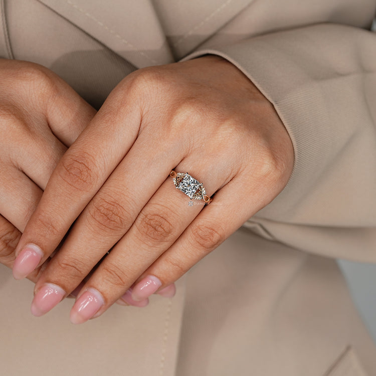 Twisted shank princess ring with nature inspired details.