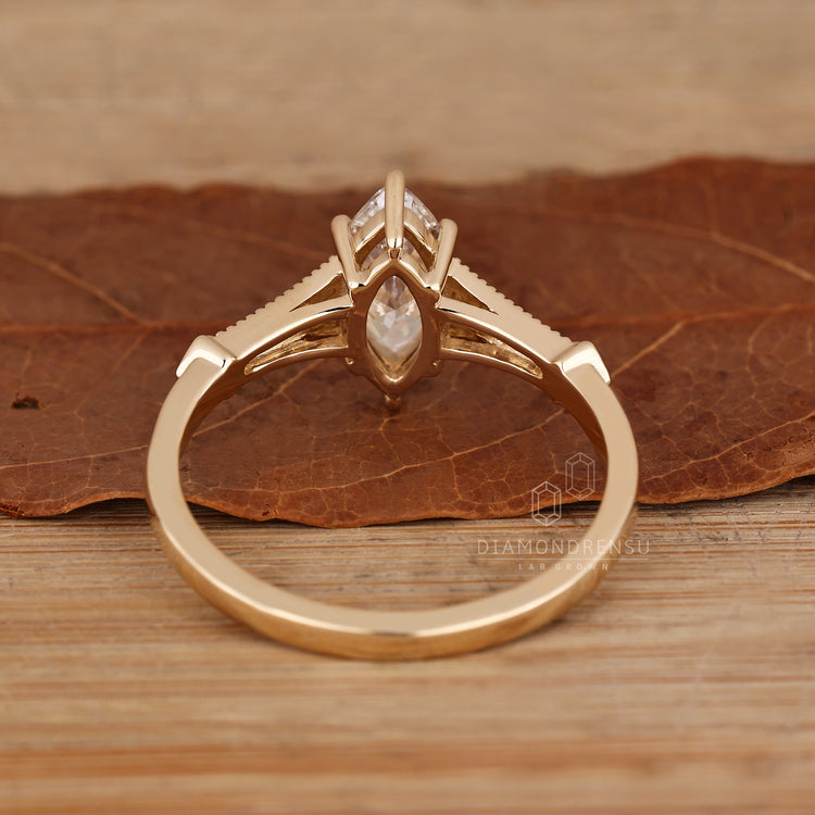 Marquise cut ring with six claw prong setting.