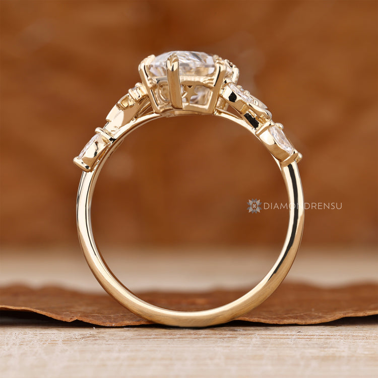Handmade lab grown diamond ring with six leaf prongs.