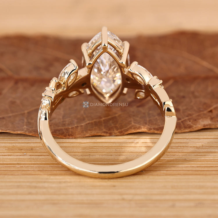 Marquise cluster ring with six claw prong setting.