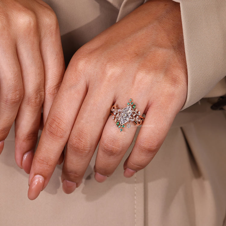Dutch Marquise ring with emerald round and marquise diamonds.