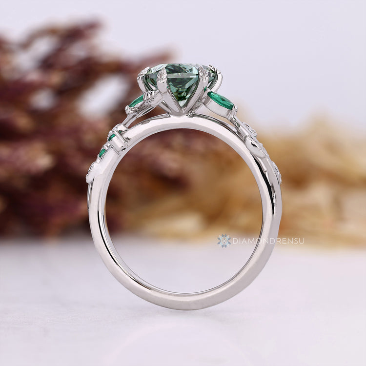 Lab grown diamond ring with green marquise centre stone.