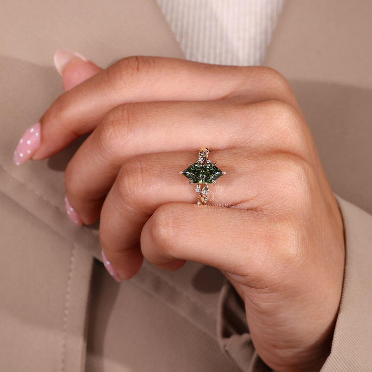Green lab diamond ring with six leaf prong setting.