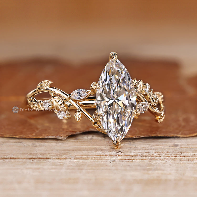Marquise engagement ring with nature inspired details.