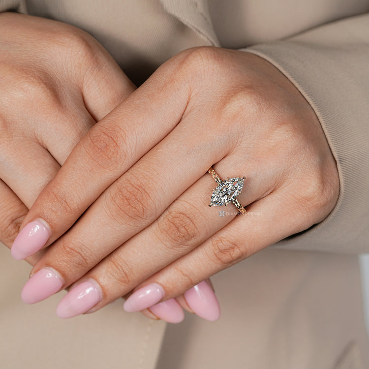 Marquise cut lab grown diamond ring with floral details.