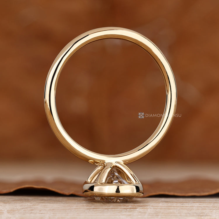 Oval diamond ring with a classic solitaire setting.