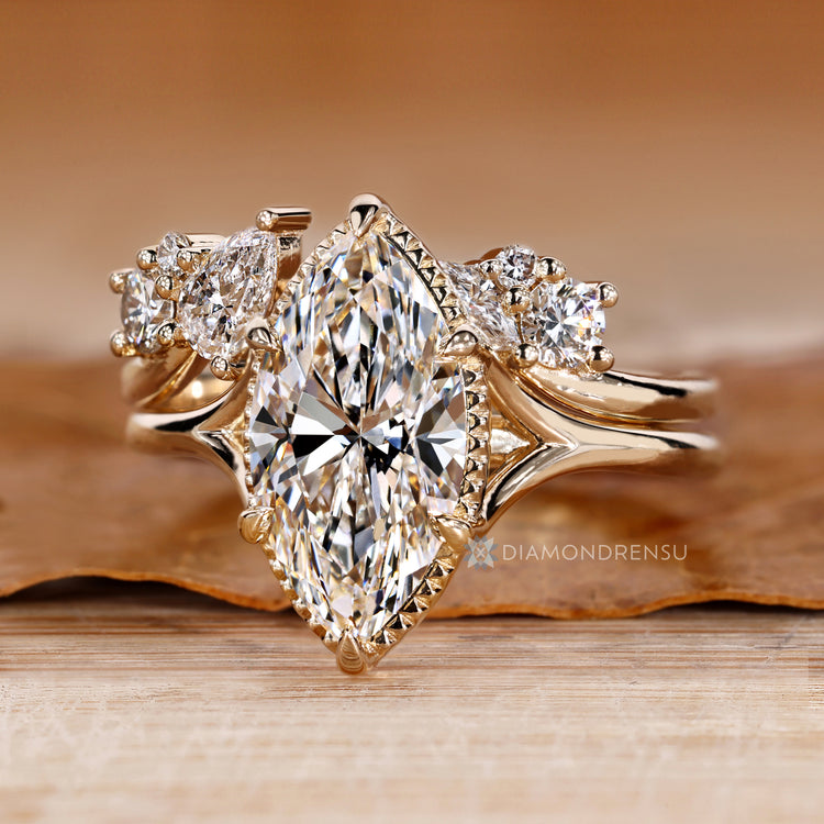 Bridal set with curvy band and marquise centre diamond.