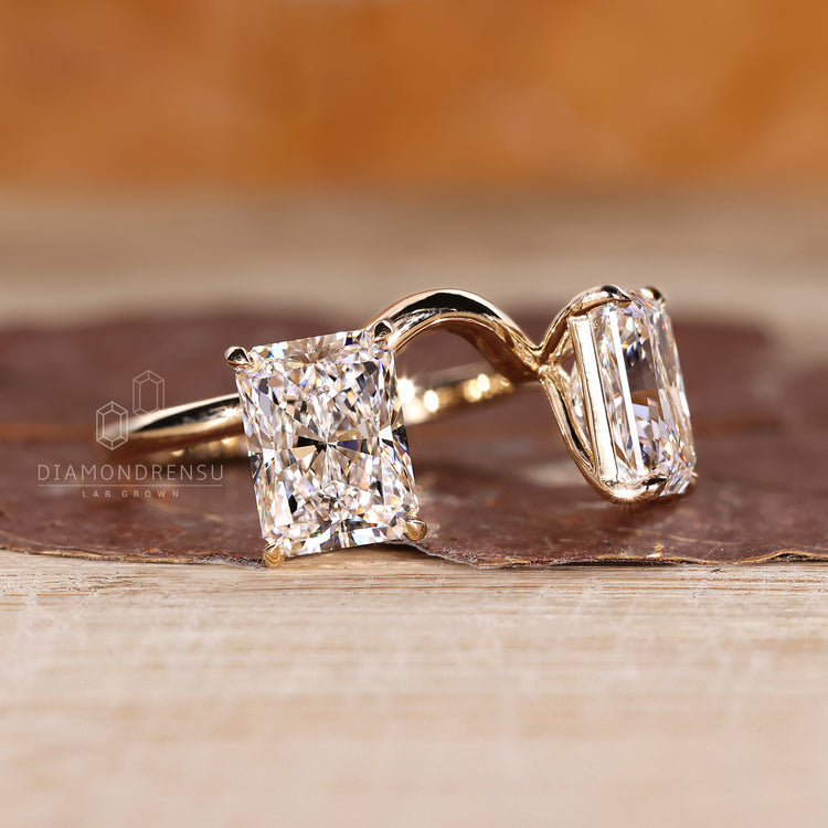 Handmade radiant diamond ring with two stone style setting.