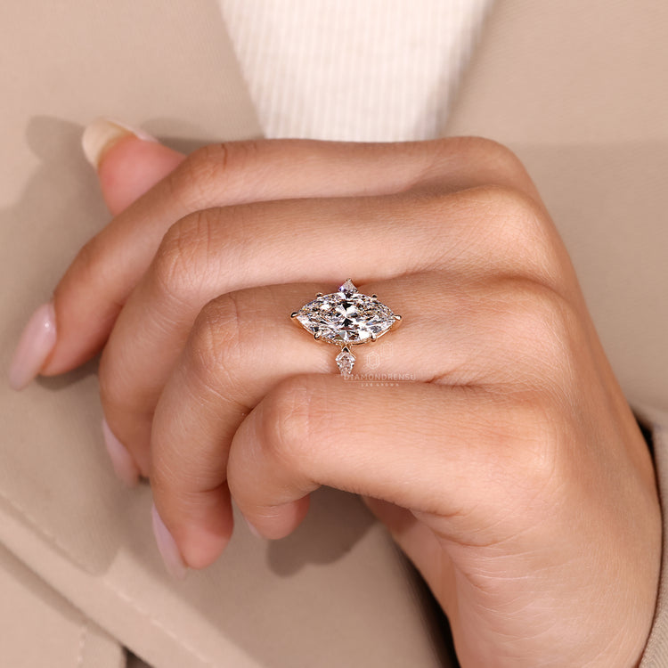 Lab grown ring with three stone and claw prong design.