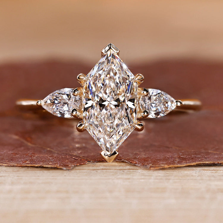 Three diamond engagement ring with dutch marquise centre stone.