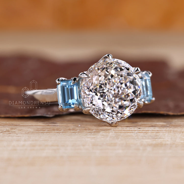 Lab grown diamond ring with sapphire sides and cathedral setting.