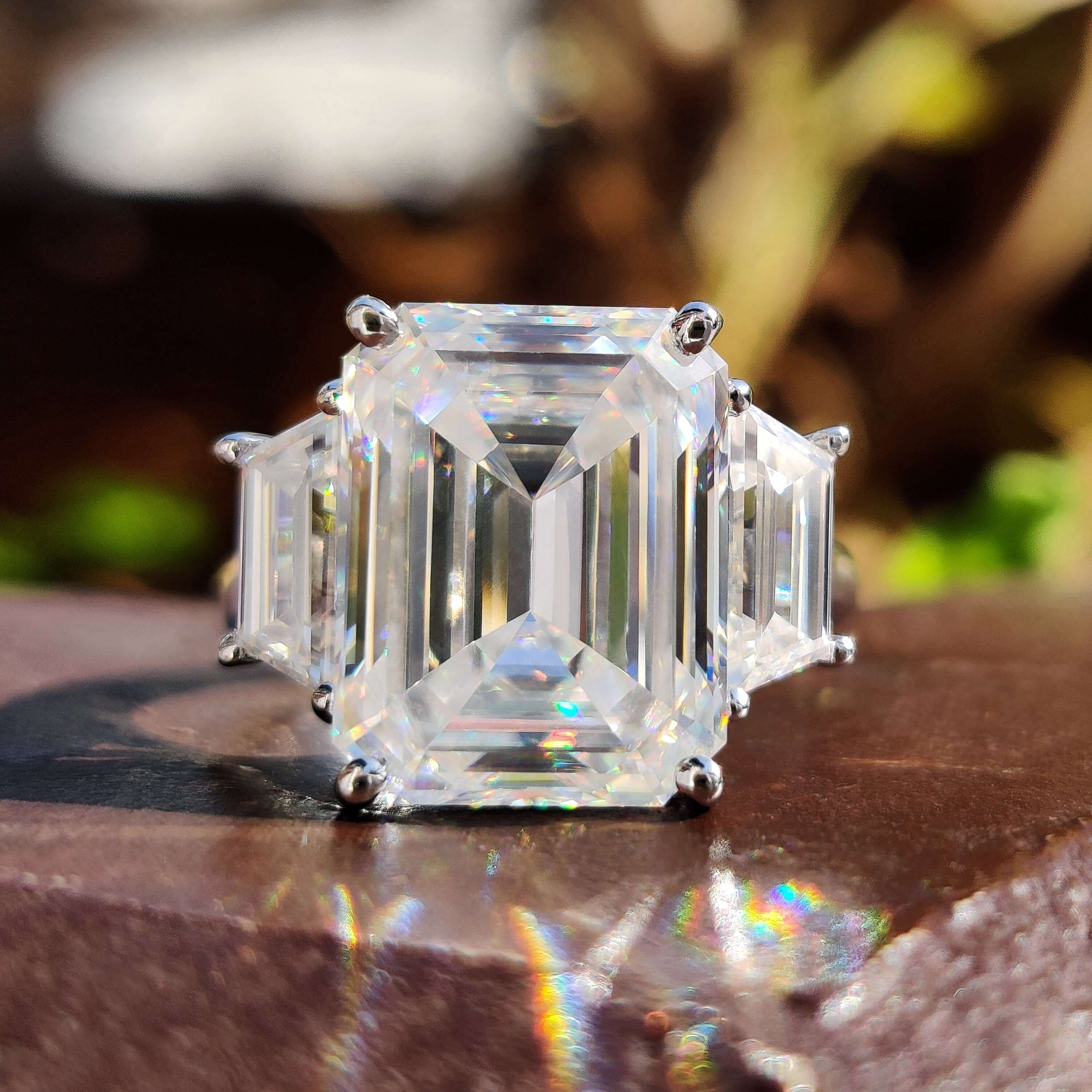 Moissanite three stone engagement ring in white gold.