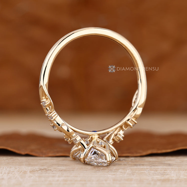 Cathedral setting marquise ring with round side stones.