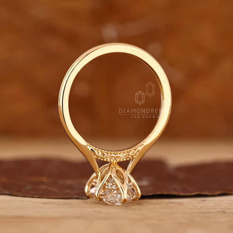 Handmade marquise diamond ring with six leaf prongs.