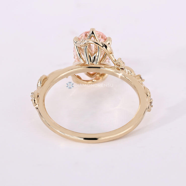IGI certified lab grown diamond ring with round side stones.