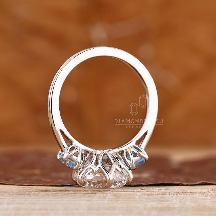 Three stone ring with Portuguese diamond and sapphire sides.